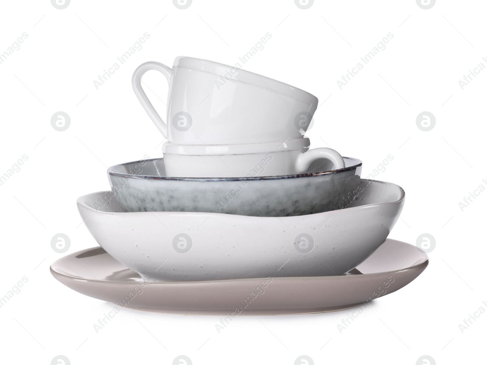 Photo of Set of clean tableware isolated on white