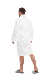 Photo of Man wearing bathrobe and slippers on white background