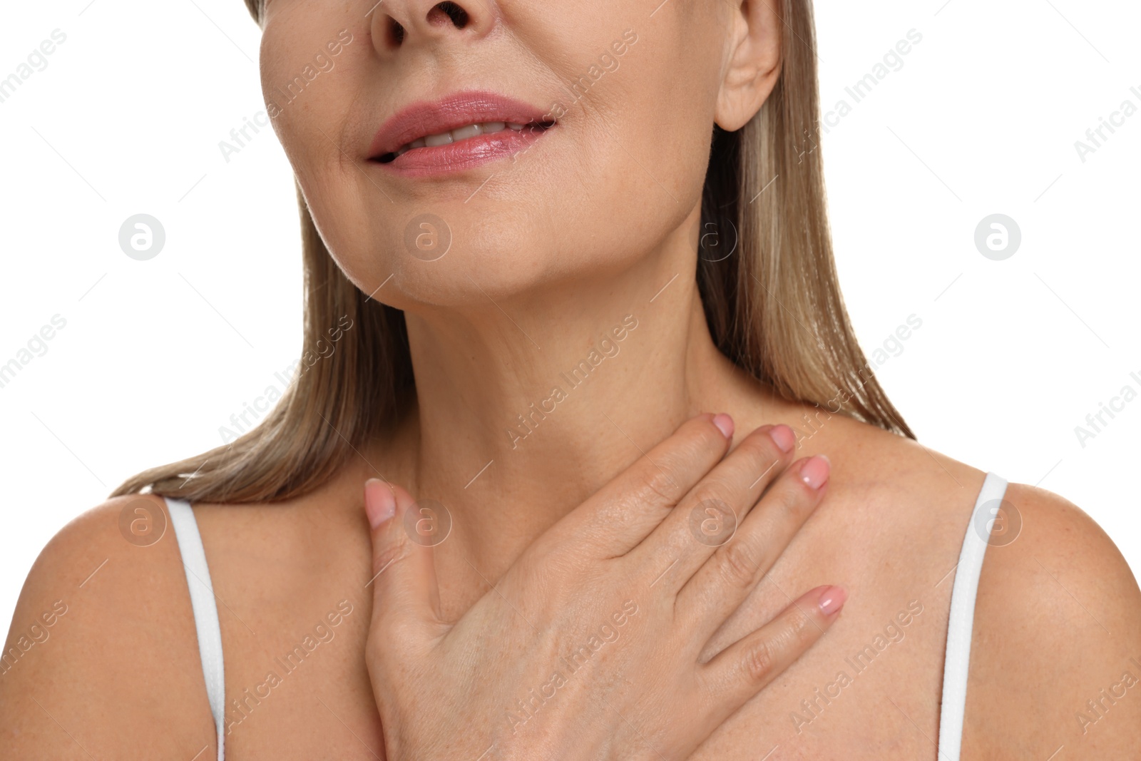 Photo of Mature woman touching her neck on white background, closeup