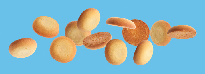 Set of falling delicious shortbread cookies on blue background. Banner design 