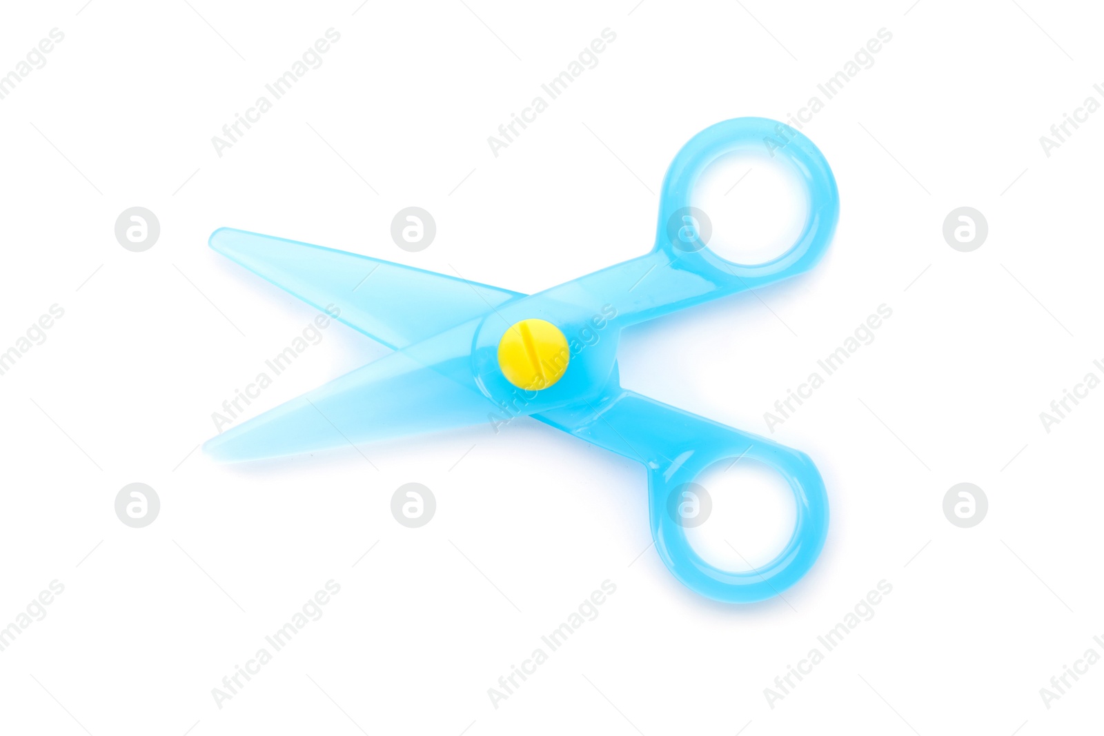 Photo of Blue plastic scissors on white background. Stationery for school