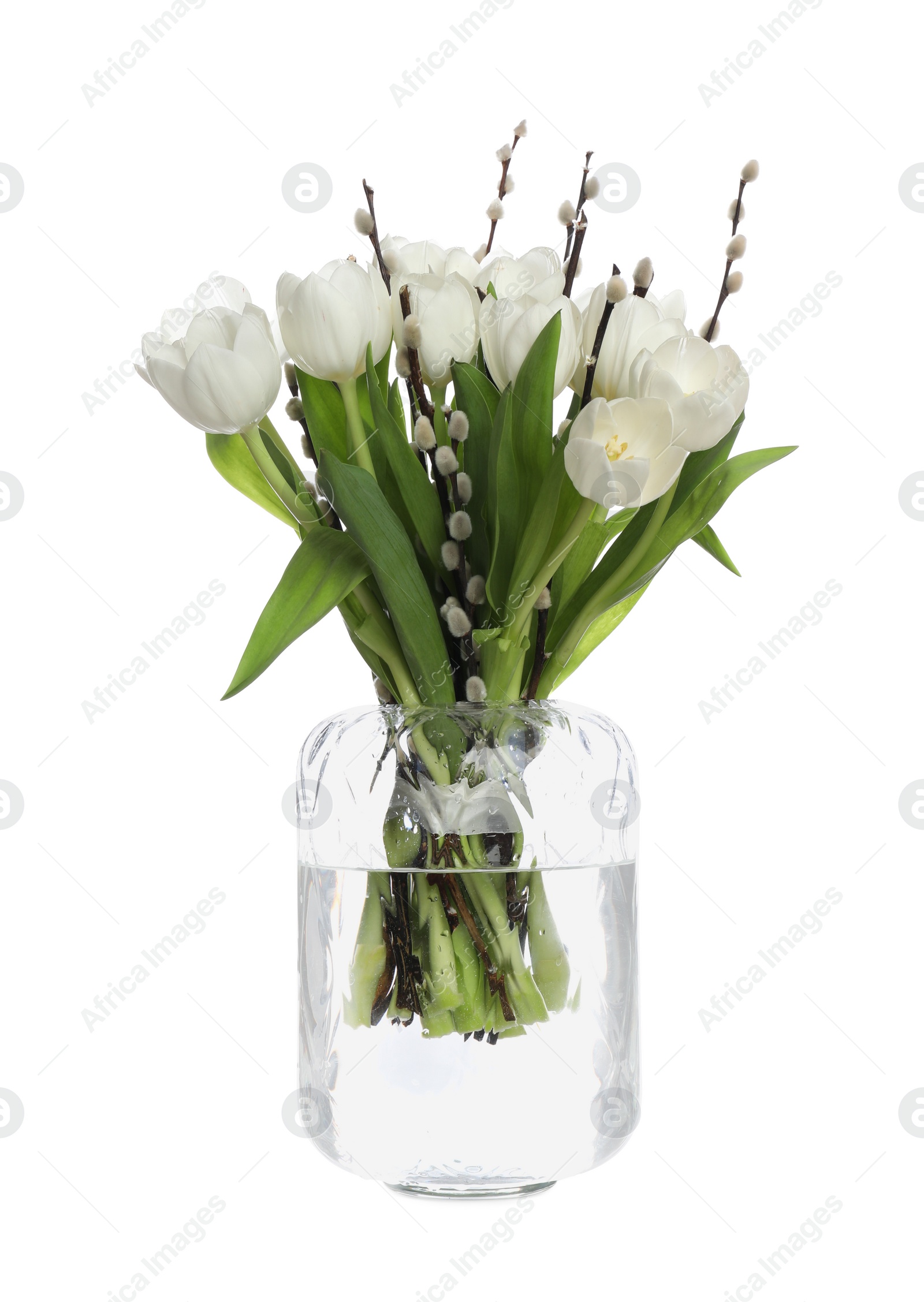 Photo of Beautiful bouquet of willow branches and tulips in vase isolated on white