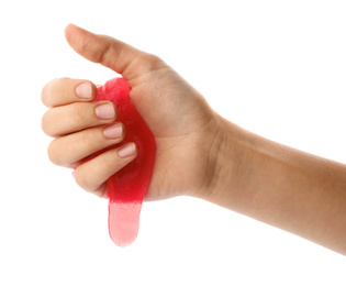 Photo of Woman playing with pink slime isolated on white, closeup. Antistress toy