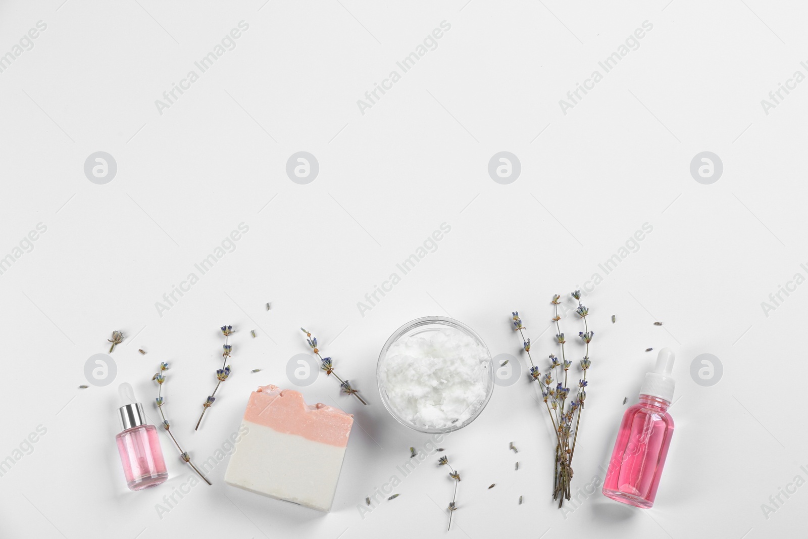 Photo of Flat lay composition with natural handmade soap and ingredients on white background. Space for text
