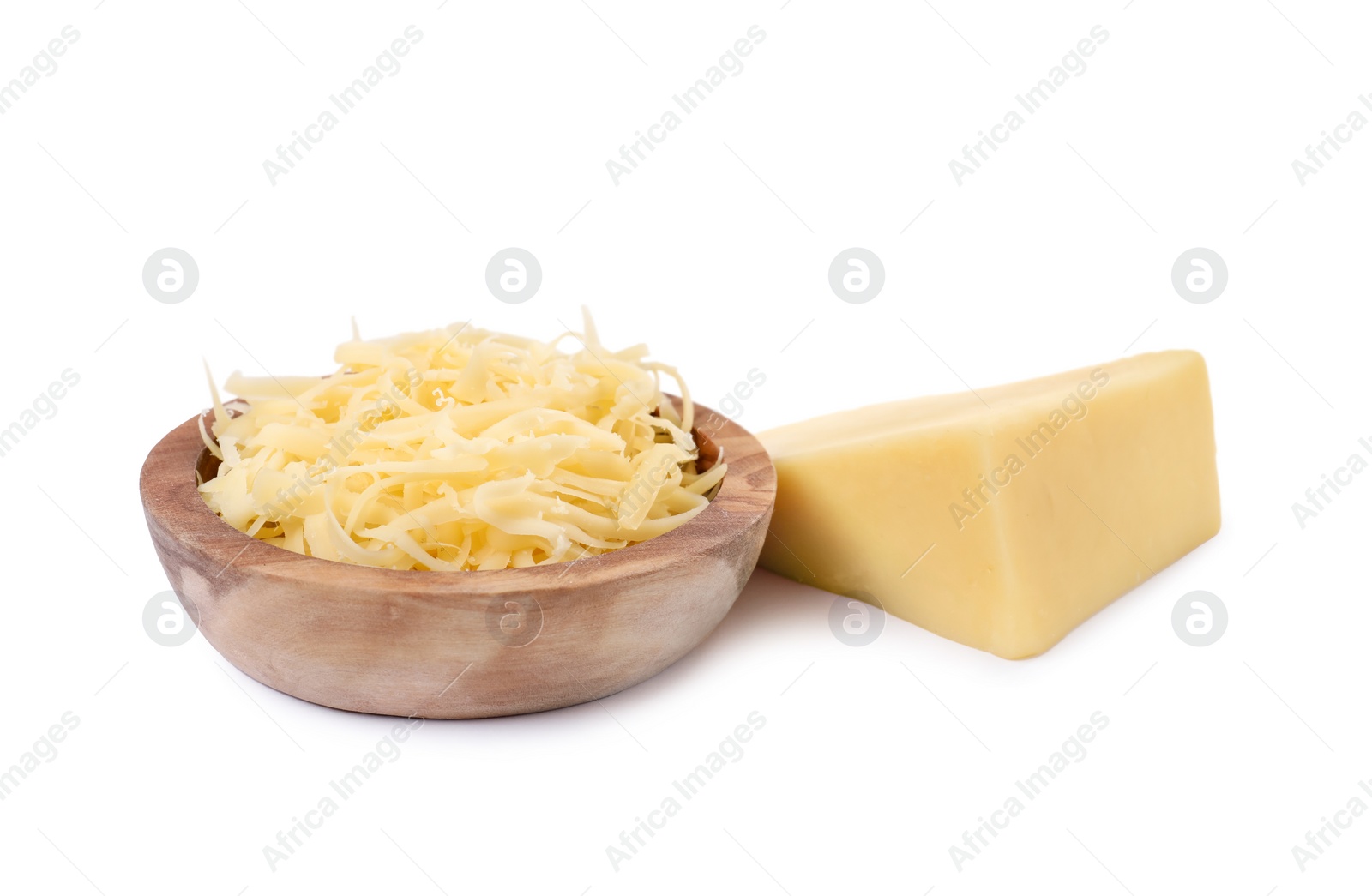 Photo of Grated cheese in bowl and piece of one isolated on white