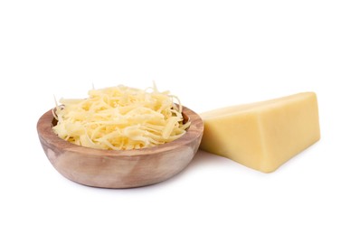 Photo of Grated cheese in bowl and piece of one isolated on white