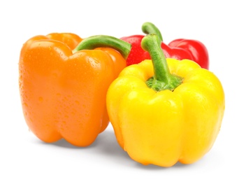 Wet ripe bell peppers on white background