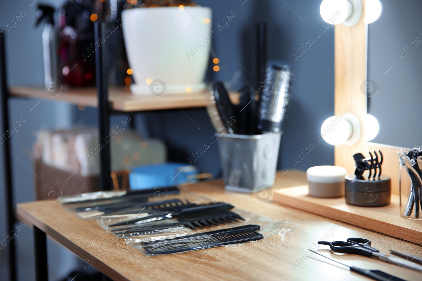 Photo of Hairdresser tools on table in salon