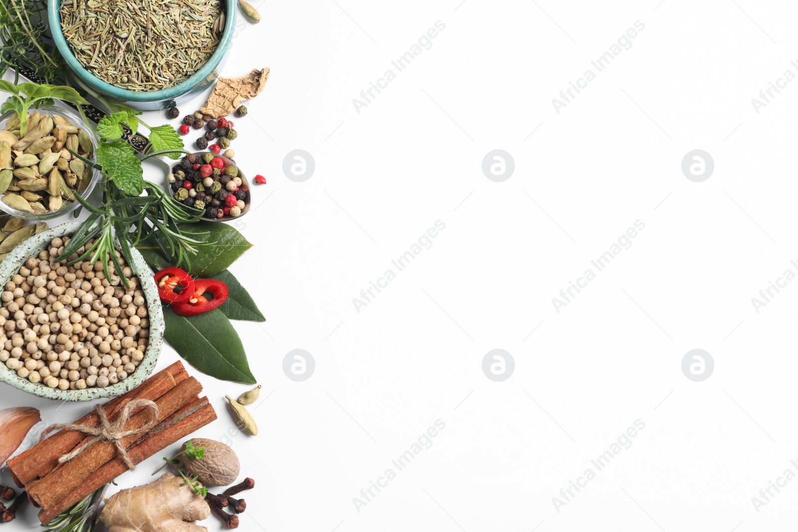 Photo of Different fresh herbs and spices on white background, top view