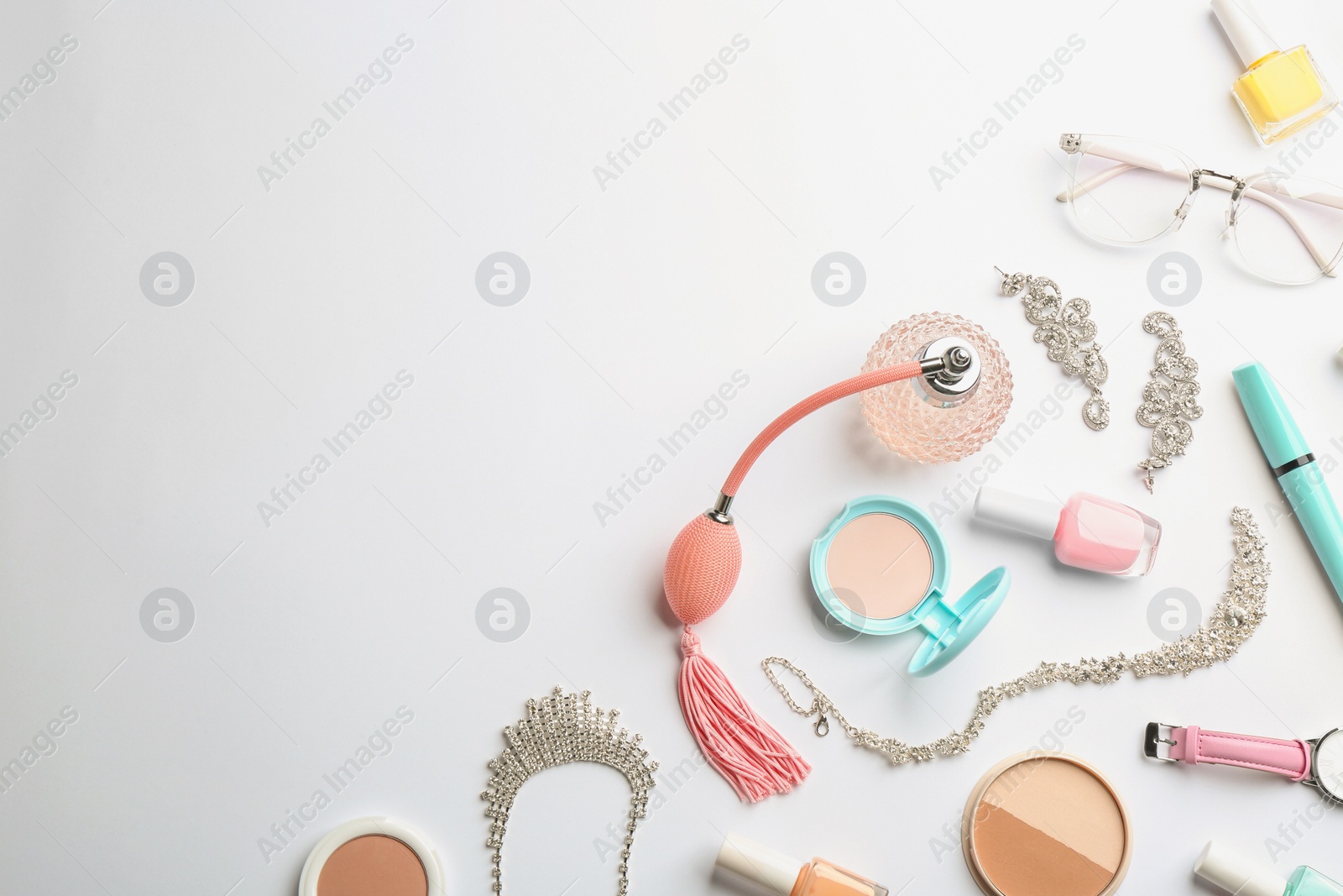 Photo of Composition with perfume bottle, cosmetics and accessories on white background, top view
