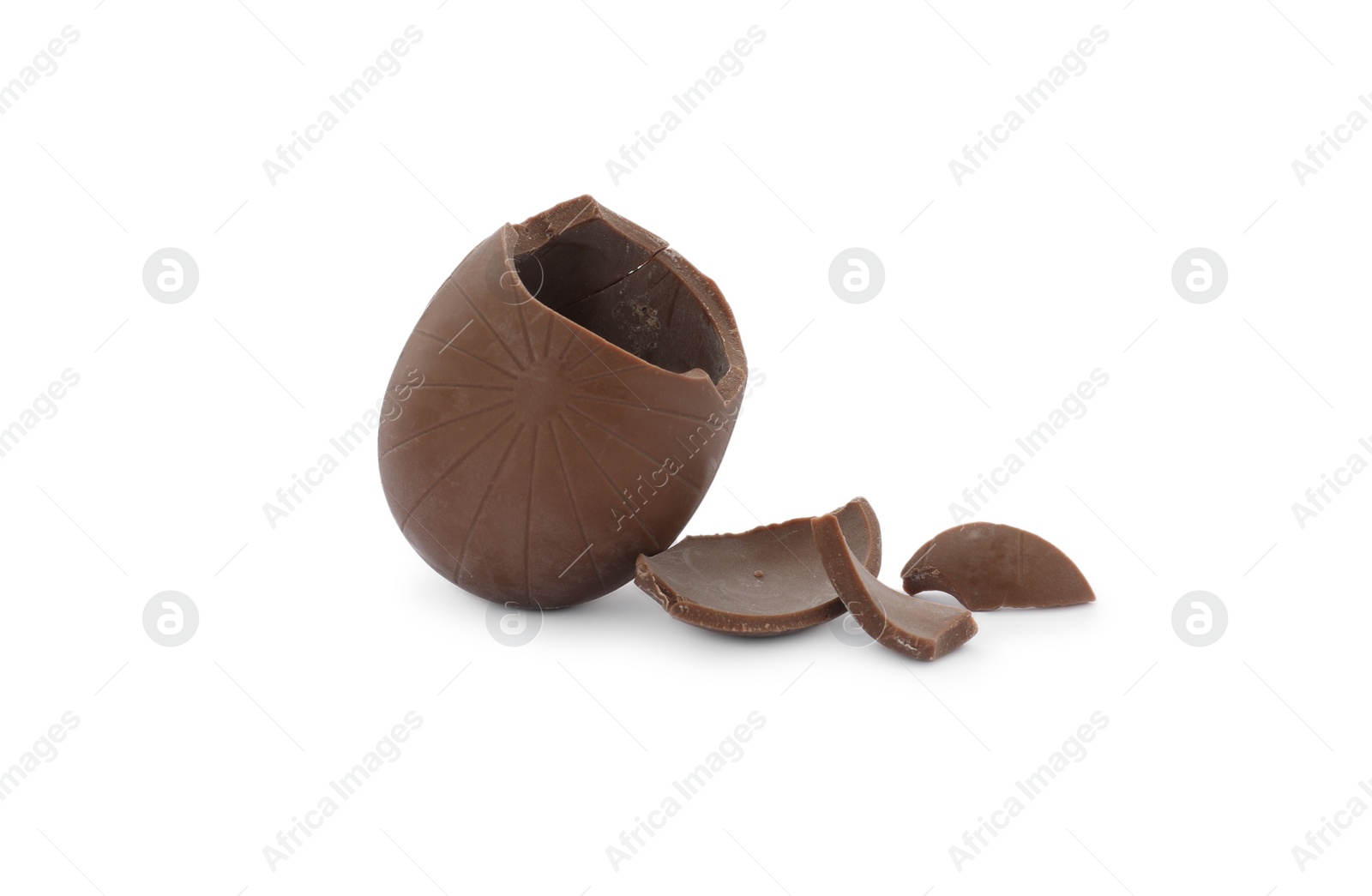 Photo of Broken milk chocolate egg on white background