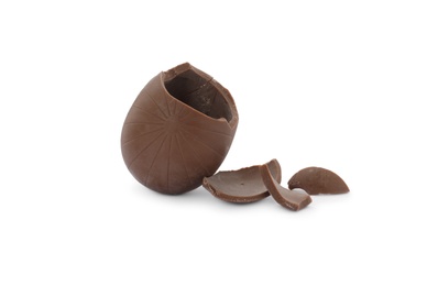 Photo of Broken milk chocolate egg on white background