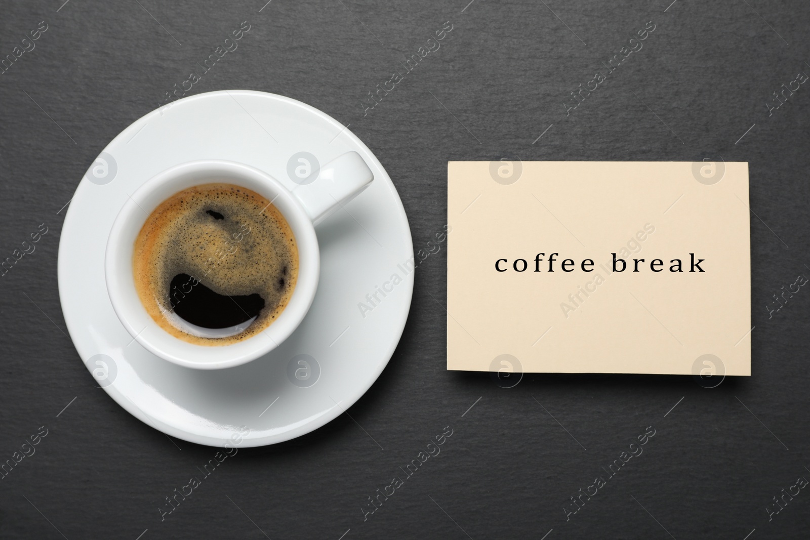Photo of Cup of hot espresso and card on black background, flat lay. Coffee break