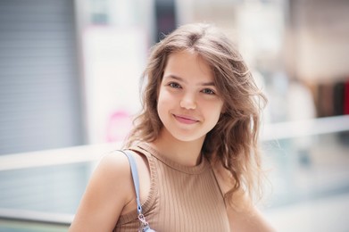 Portrait of beautiful teenage girl in shopping mall
