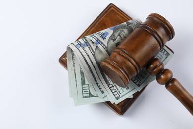Photo of Judge's gavel and money on white background, top view. Space for text