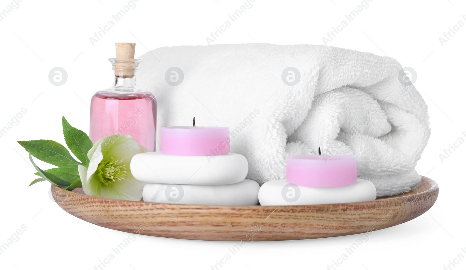 Photo of Tray with towel and spa supplies isolated on white