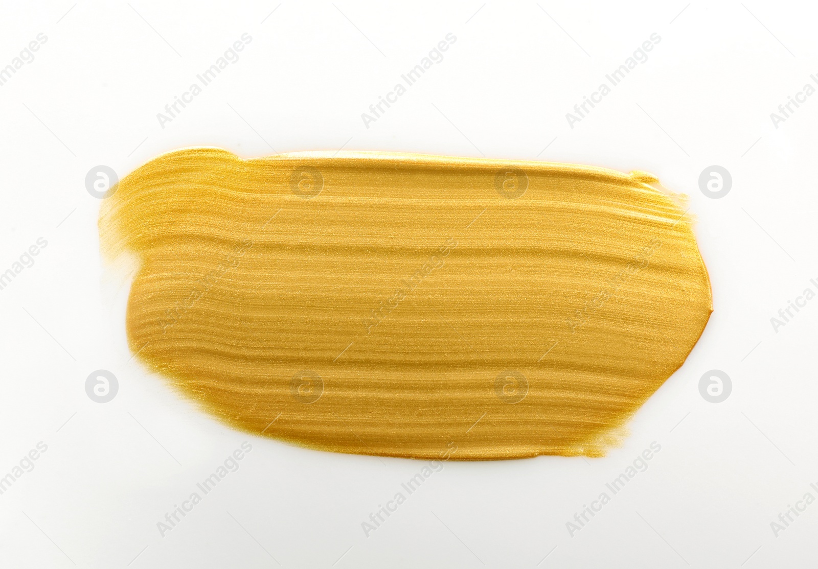 Photo of Stroke of gold paint isolated on white, top view