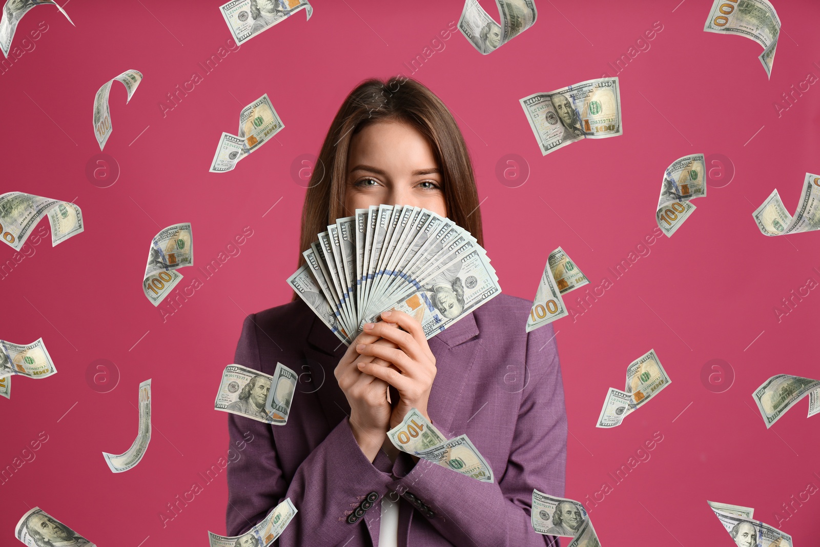 Image of Woman with American dollars under money rain on color background