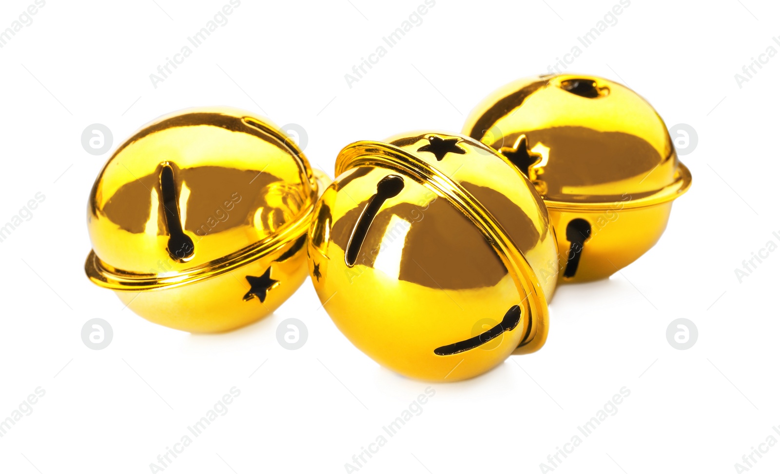 Photo of Shiny golden sleigh bells on white background