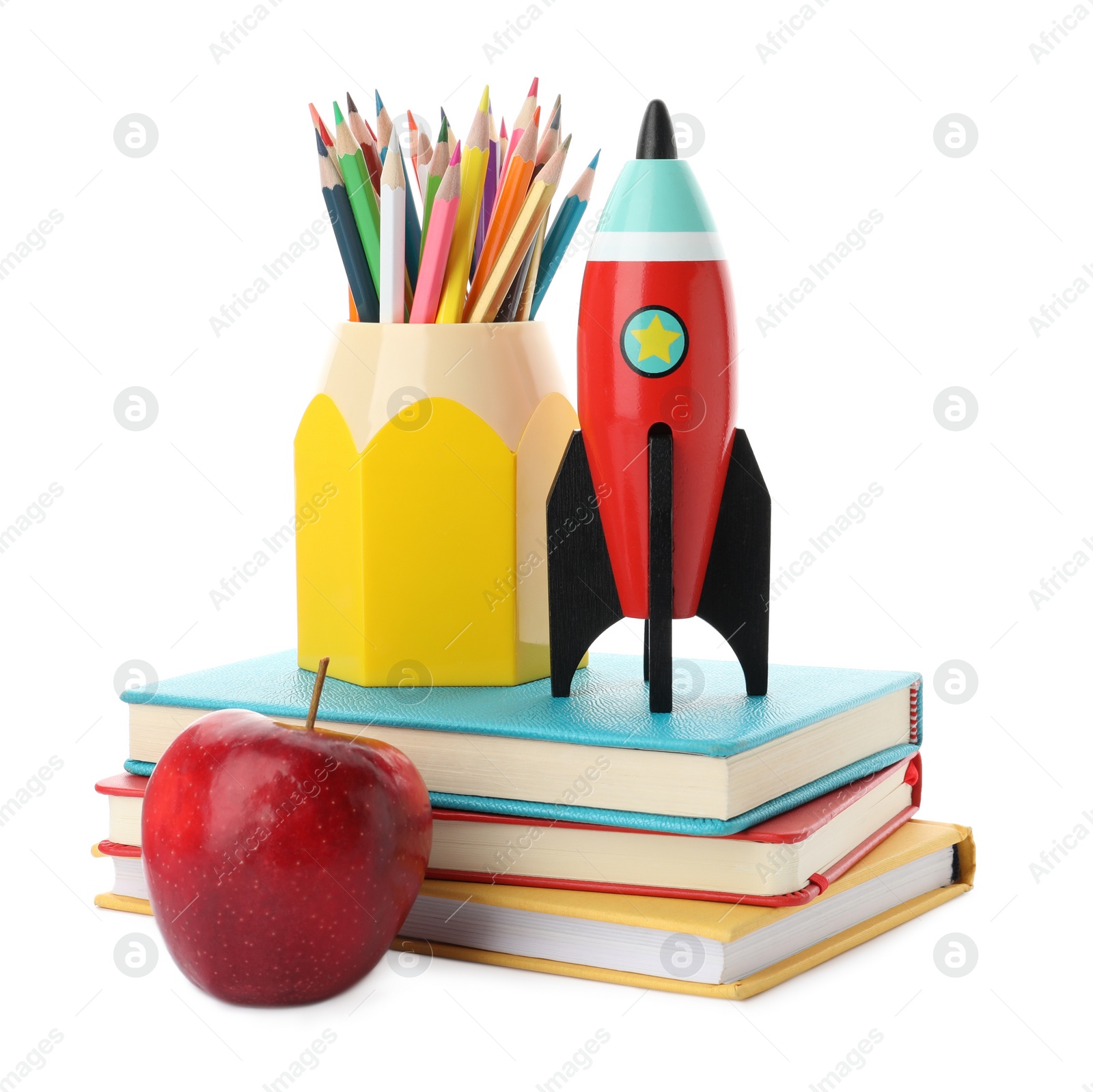 Photo of Bright toy rocket and school supplies on white background