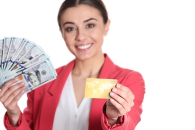 Photo of Portrait of young woman holding money banknotes and credit card on white background