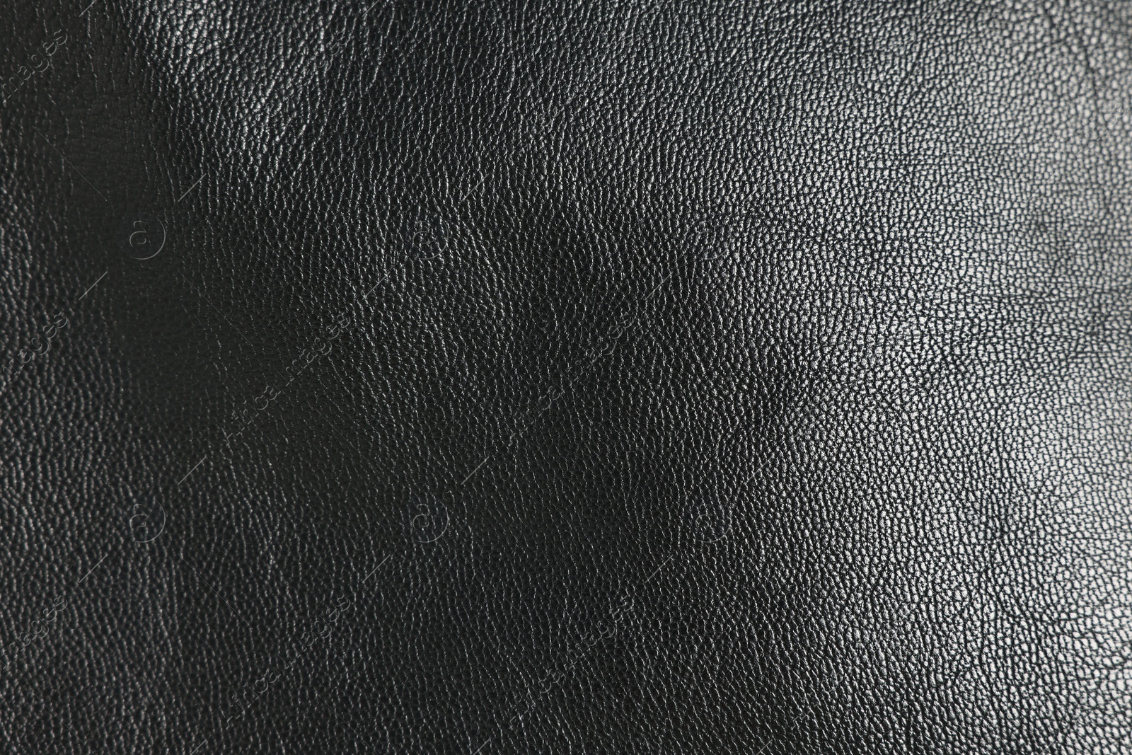 Photo of Black natural leather as background, top view