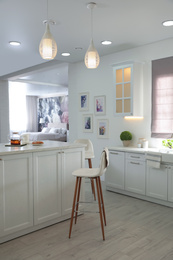 Photo of Breakfast served on table in modern kitchen. Interior design