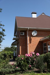 Photo of Beautiful view of modern cottage house outdoors