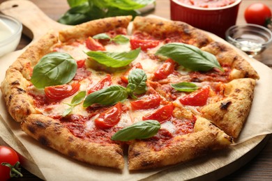 Photo of Delicious Margherita pizza on table, closeup view