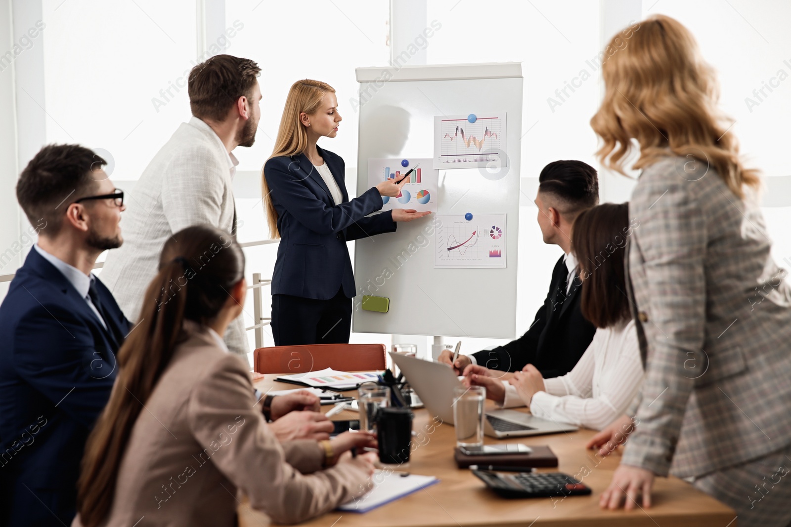 Photo of Businesspeople having meeting in office. Management consulting