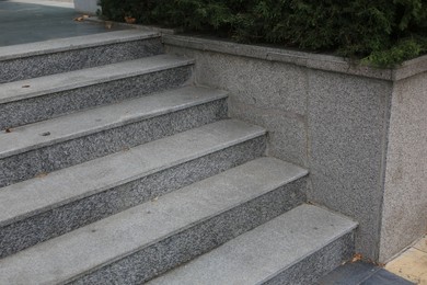 Photo of View of empty grey tile staircase outdoors