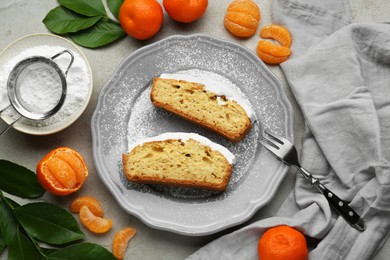 Photo of Delicious homemade yogurt cake with tangerines and powdered sugar on gray table, flat lay