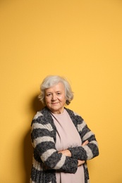 Photo of Portrait of elderly woman on color background