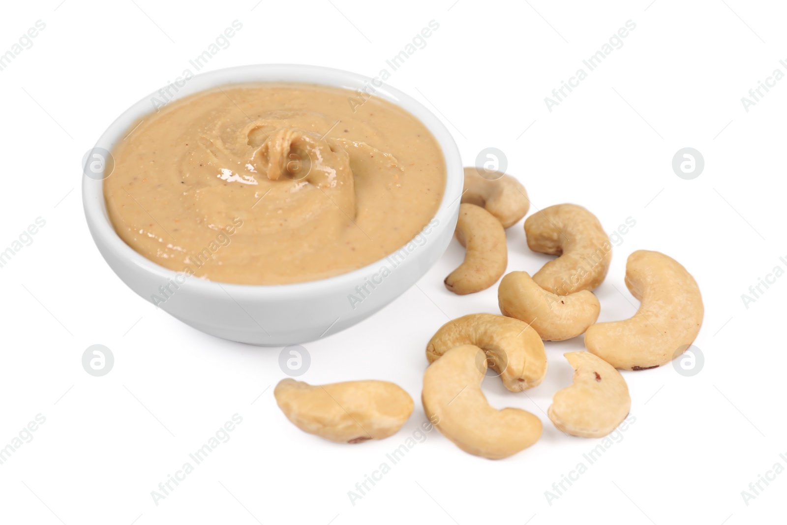 Photo of Delicious nut butter and cashews isolated on white