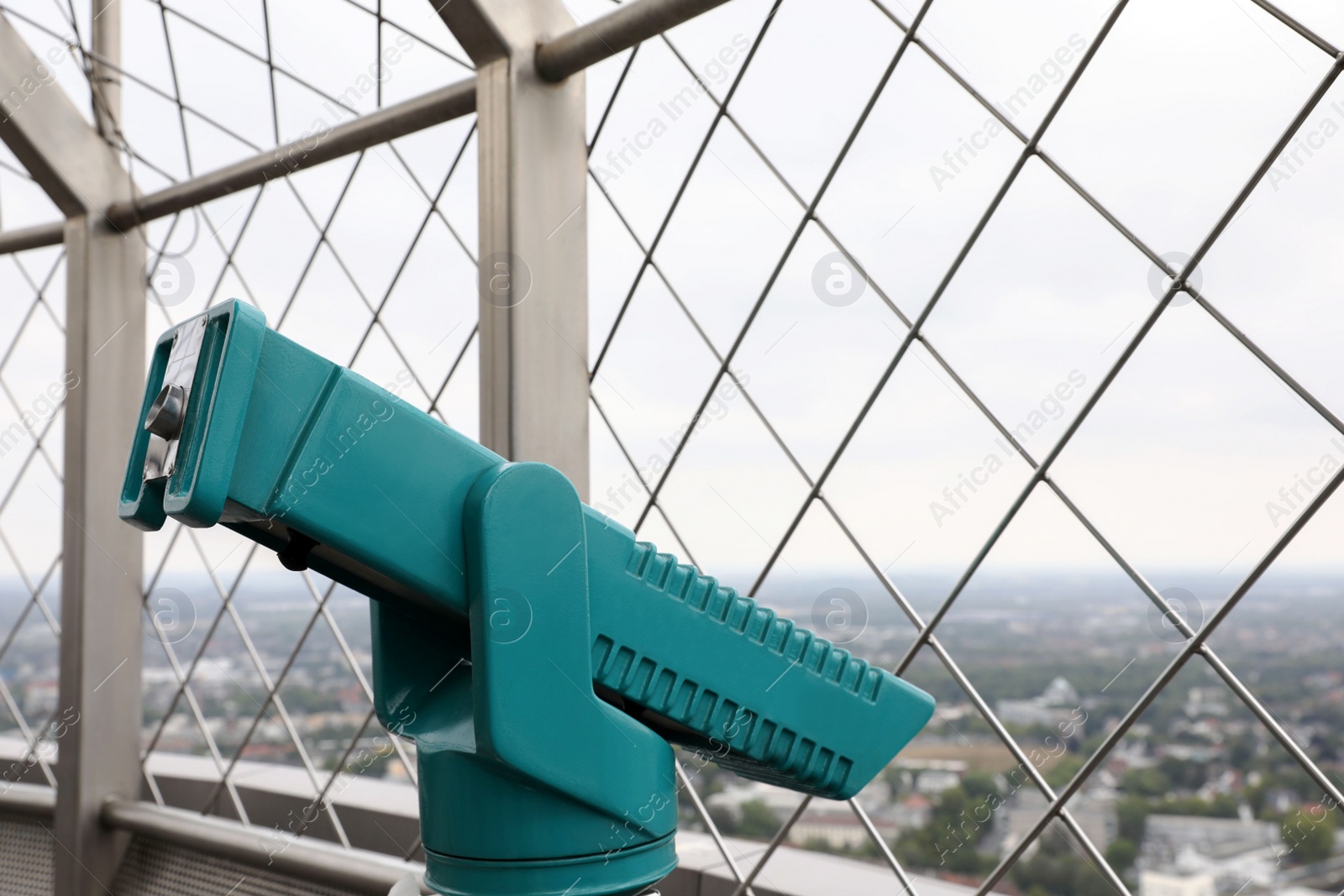 Photo of Green metal tower viewer on observation deck. Space for text