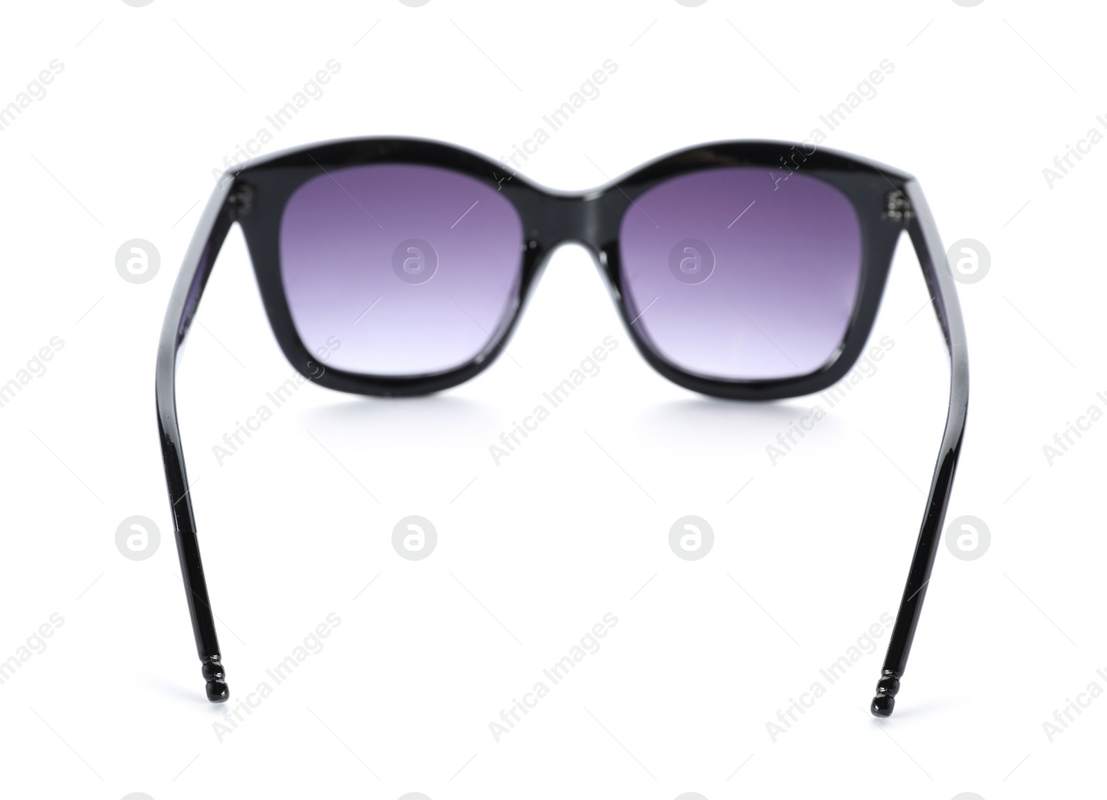 Photo of Beautiful sunglasses on white background. Beach object