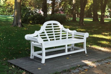 Photo of Beautiful white bench in public city park