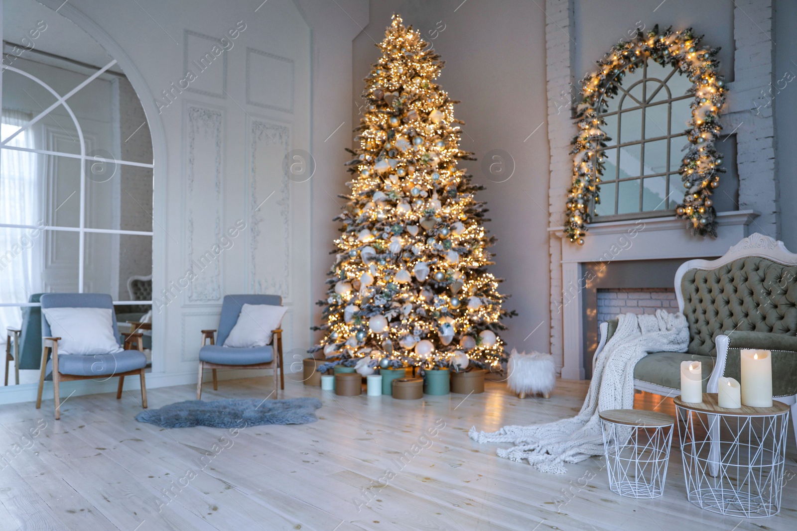 Photo of Festive room interior with stylish furniture and beautiful Christmas tree