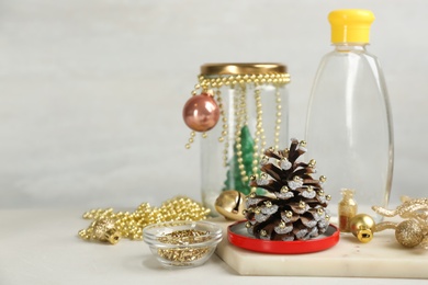 Photo of Materials for handmade snow globe on light table, space for text