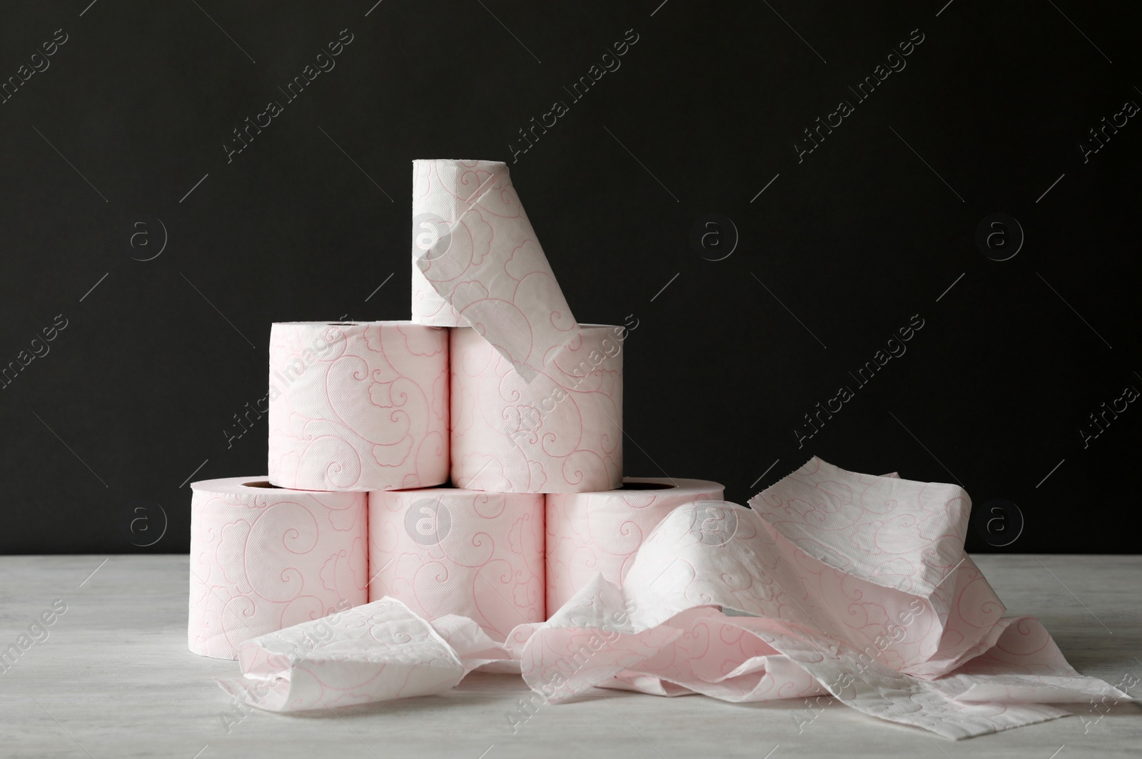 Photo of Many toilet paper rolls on light table