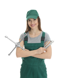 Portrait of professional auto mechanic with wrenches on white background