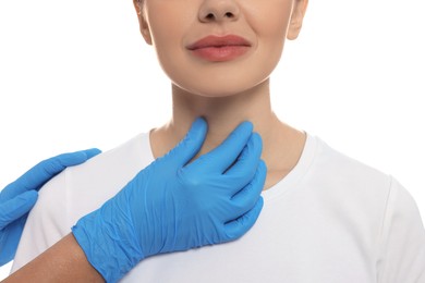 Endocrinologist examining thyroid gland of patient on white background, closeup