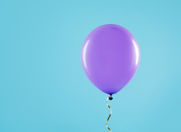 Photo of Bright balloon on color background, space for text. Celebration time