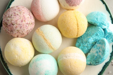 Plate with colorful bath bombs, top view