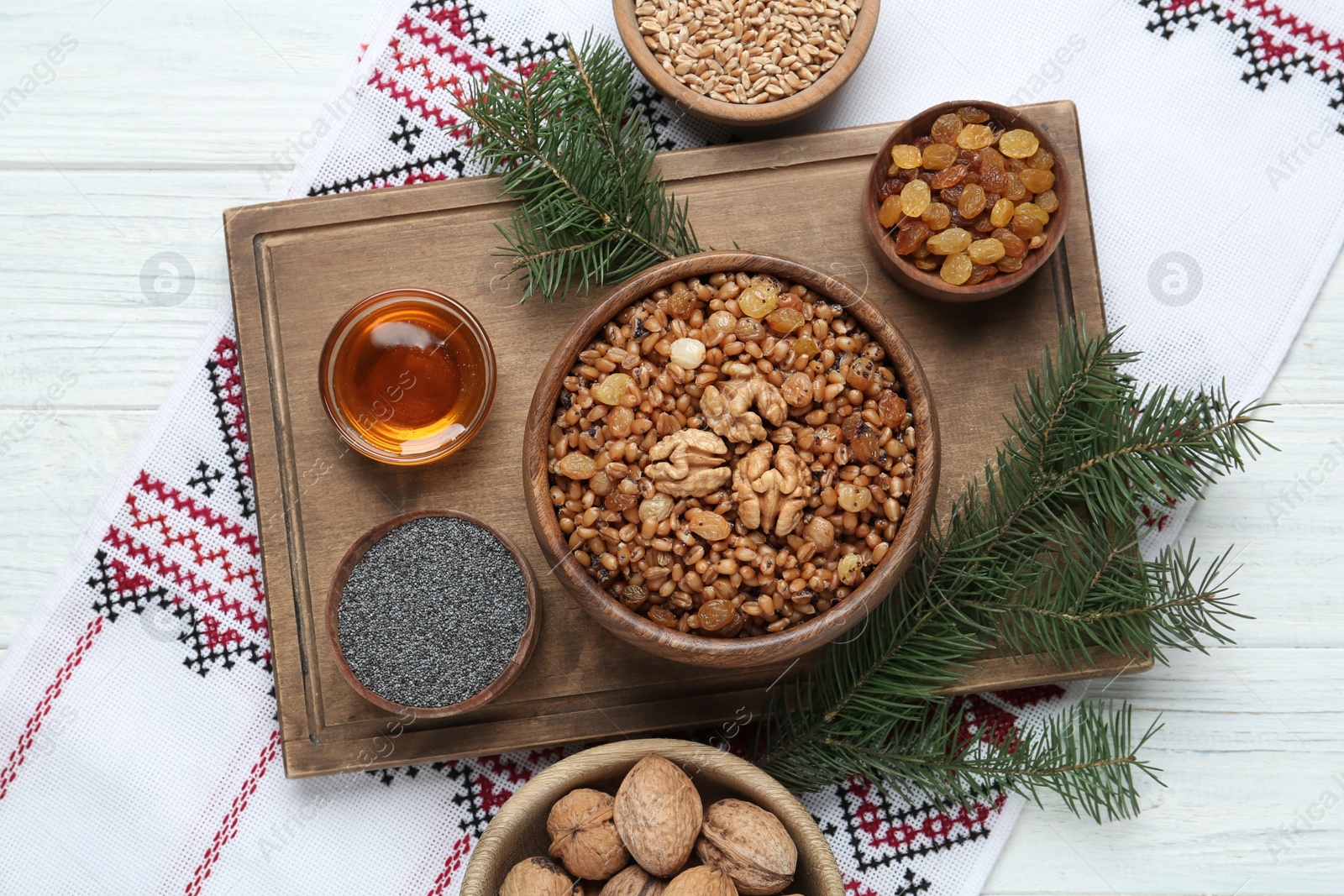 Photo of Flat lay composition with tasty traditional kutia on light table