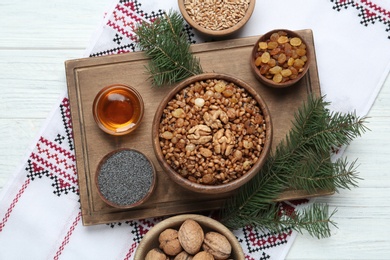 Flat lay composition with tasty traditional kutia on light table