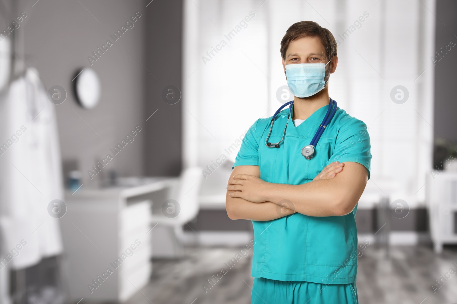 Image of Nurse with stethoscope and medical mask in uniform at hospital