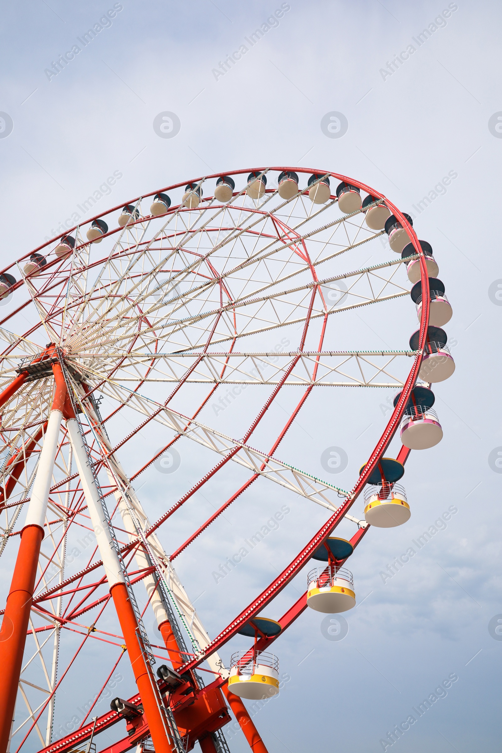 Photo of Beautiful large Ferris wheel outdoors, low angle view