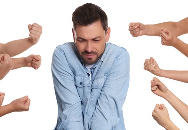 Photo of People bullying scared man on white background