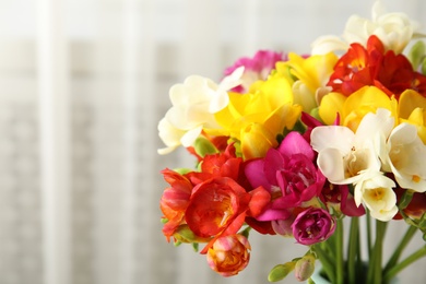 Beautiful bright spring freesia flowers, closeup. Space for text